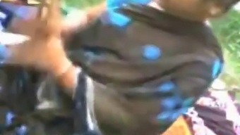 Mature Indian Woman And Young Boy Engage In Sensual Play With Her Breasts And Private Area