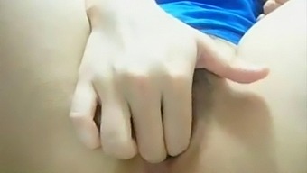 Asian Teen Indulges In Solo Play With Cucumber